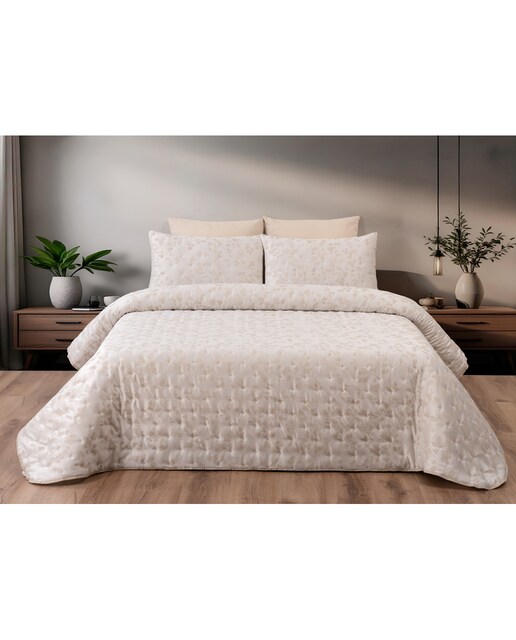 Colcha bouti estampada con fundas de cojin a juego.