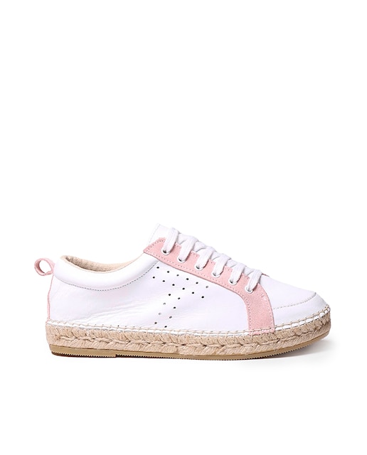 Imagen 0 de Zapatilla deportiva de mujer elaborada en piel de color blnco con bandas de serraje en color contrastado.