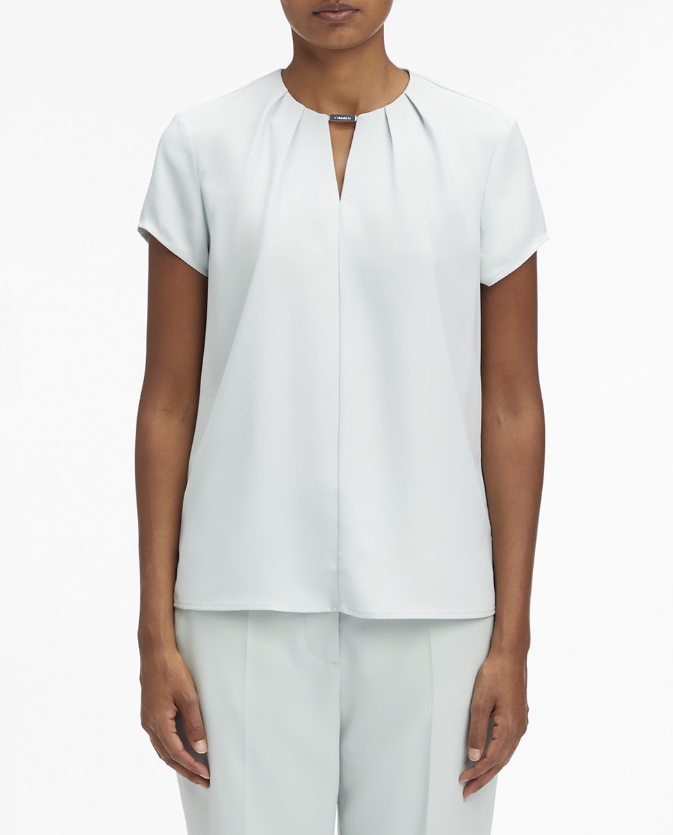 Imagen 0 de Blusa estampada con detalle metálico de manga corta