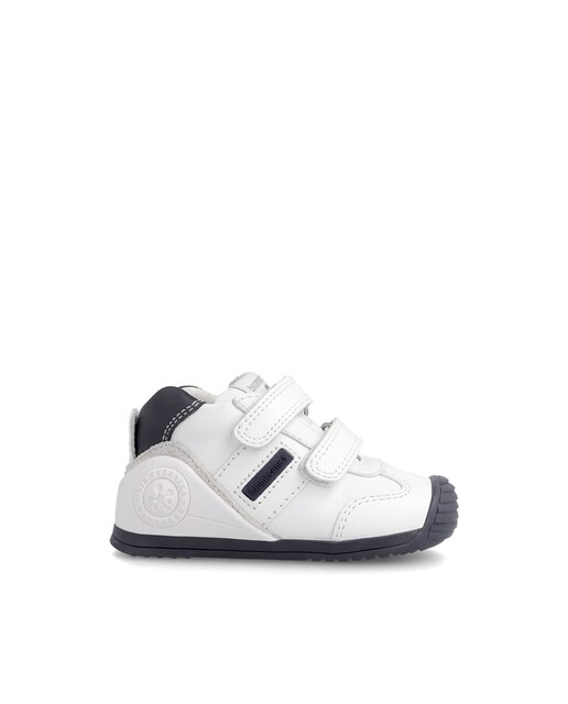 Imagen 0 de Zapatillas de bebé niño en blanco y azul marino bajas de piel con puntera reforzada y doble cierre adherente