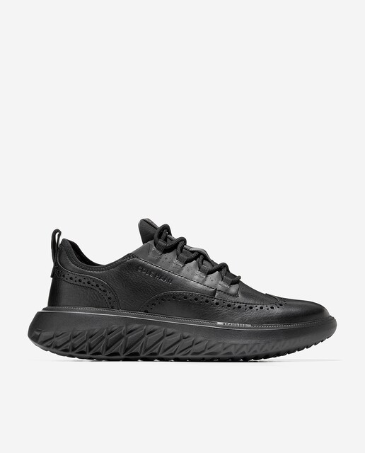 Imagen 0 de Zapatillas de piel de hombre con diseño brogue clásico