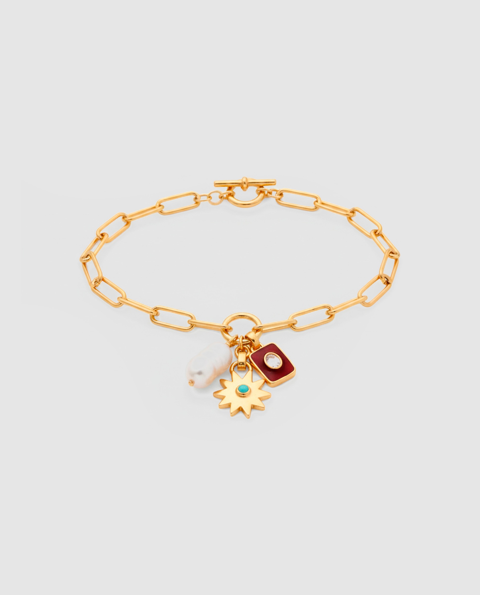 Imagem 0 de Pulseira com Charms Boho de Aço Acabada em Ouro Amarelo 18 Quilates com Pérola Branca