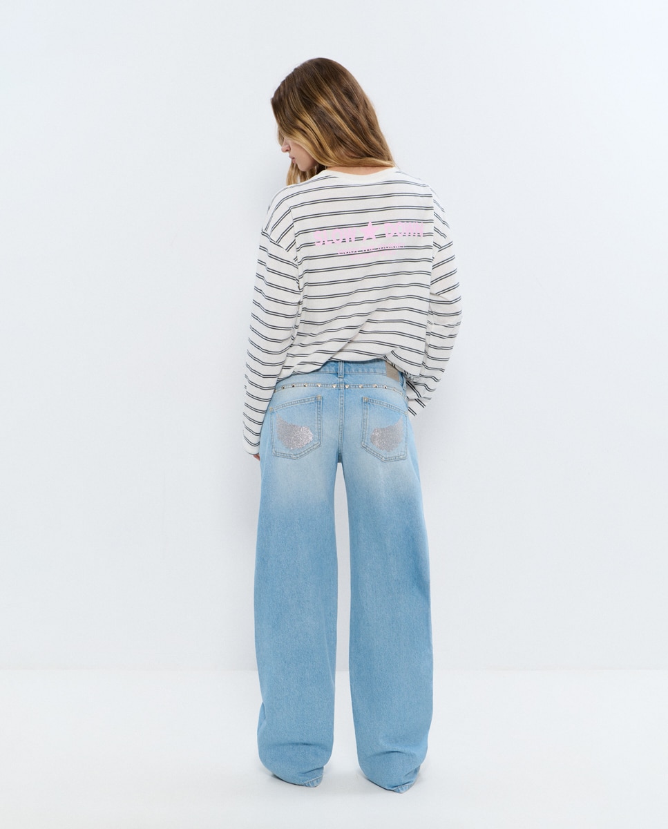 Imagem 0 de Jeans Largo com Asas e Tachas