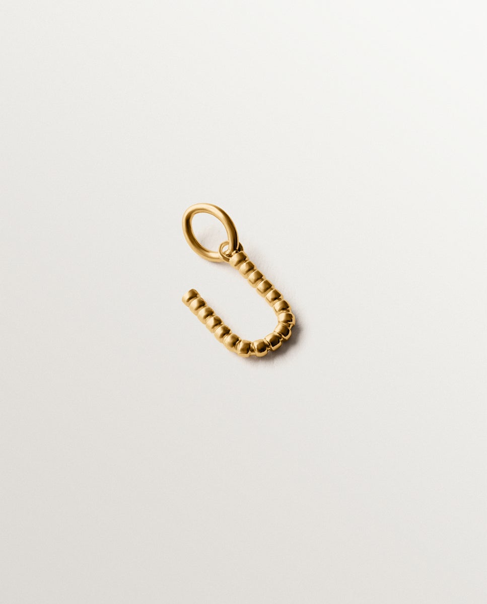 Imagem 0 de Charm de Prata 925 com Banho em Ouro Amarelo de 18k com Letra U e Motivos de Esferas