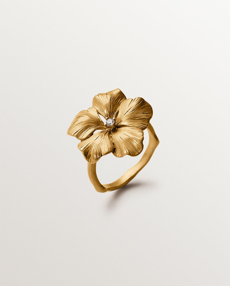 Imagem 0 de Anel Banhado a Ouro em Amarelo com Cristal e Forma de Flor