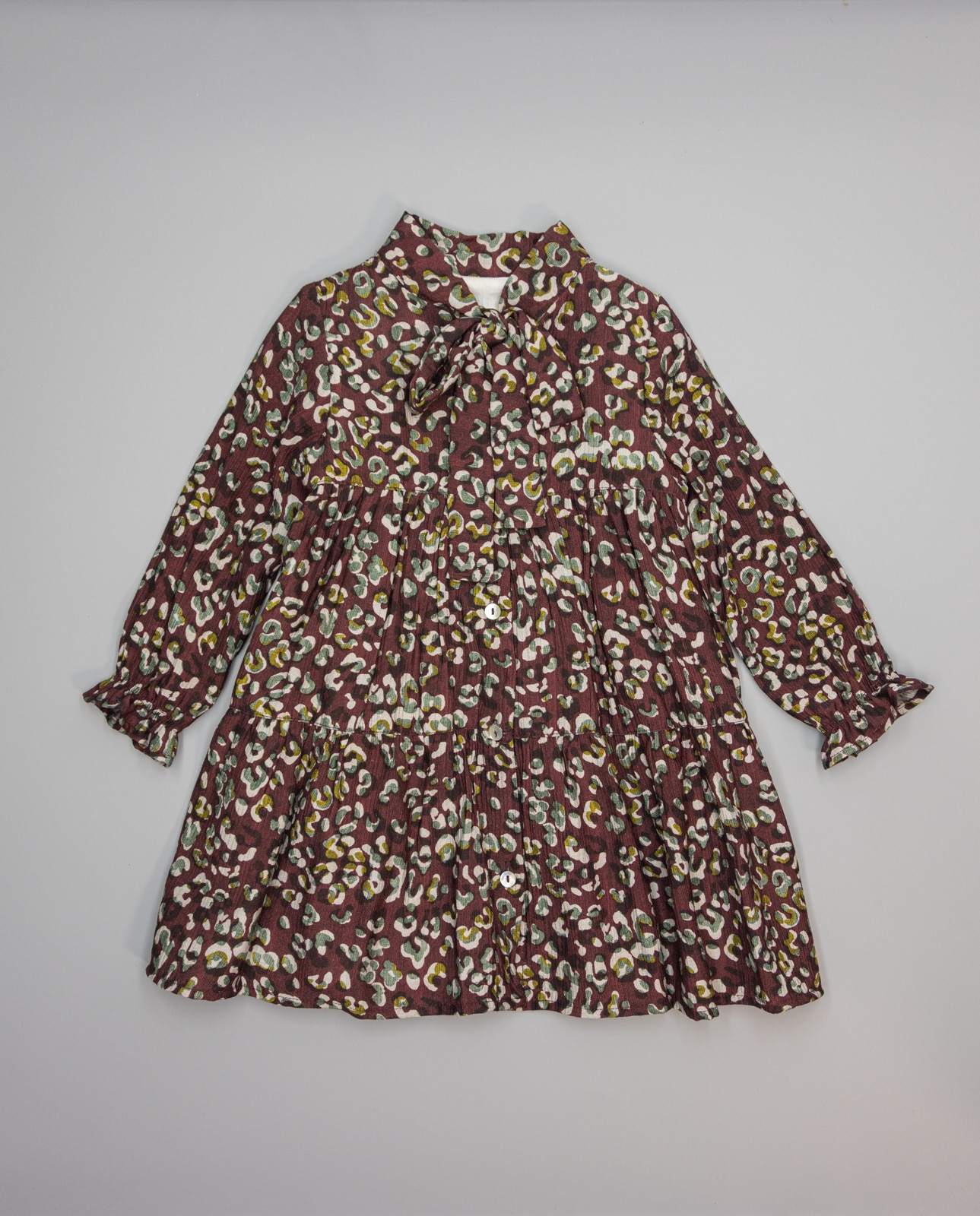 Imagem 0 de Vestido Bordeaux Animal Print com Folhos e Laçada na Gola