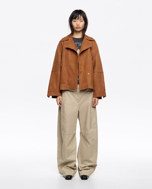 Imagem 0 de Blusão Cruzado em Pele com Franjas