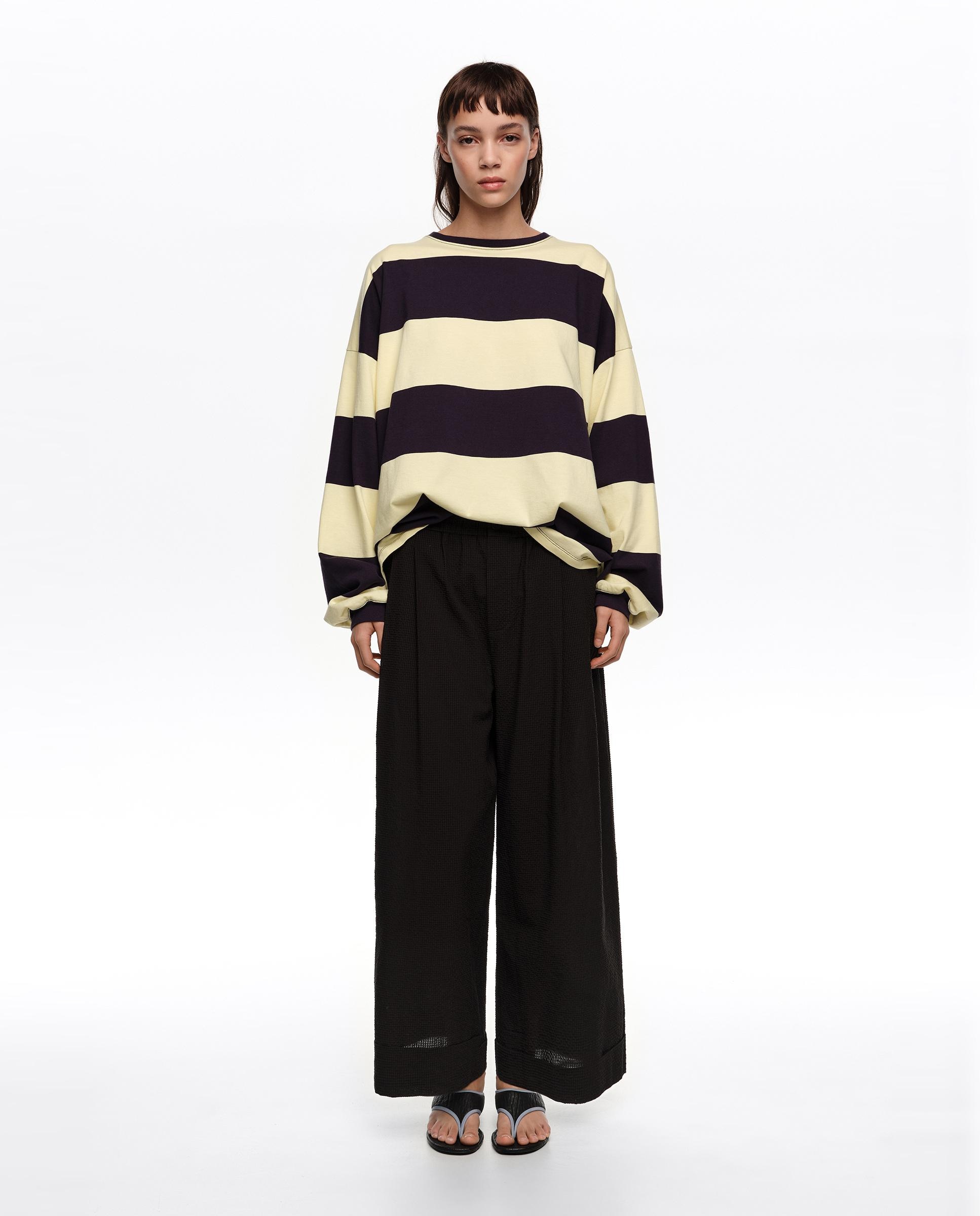 Imagem 0 de Calças À Boca de Sino com Textura na Bainha