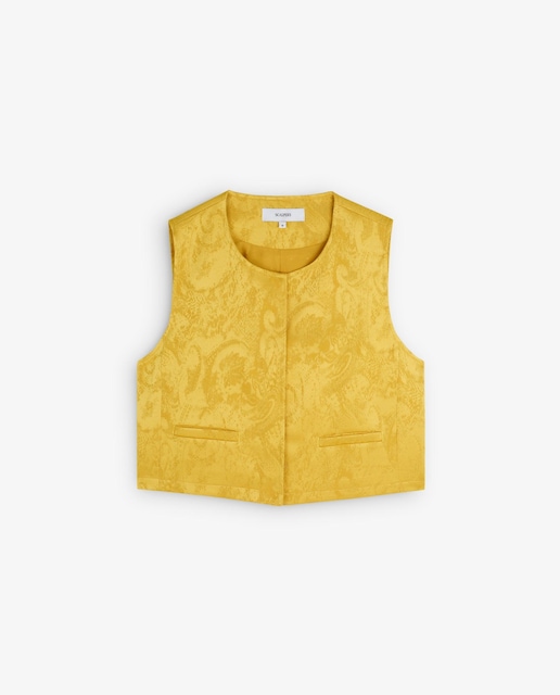 Imagem 0 de Colete de jacquard. Corte cropped com gola redonda e manga em cava. Fecho com botões e bolsos frontais ocultos.