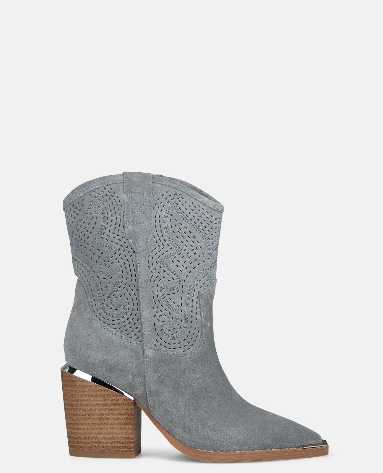 Imagem 0 de Botins Cowboy em Pele Efeito Jeans com Detalhe Perfurado