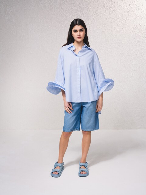 Imagem 0 de Blusa às riscas com pormenor nas mangas
