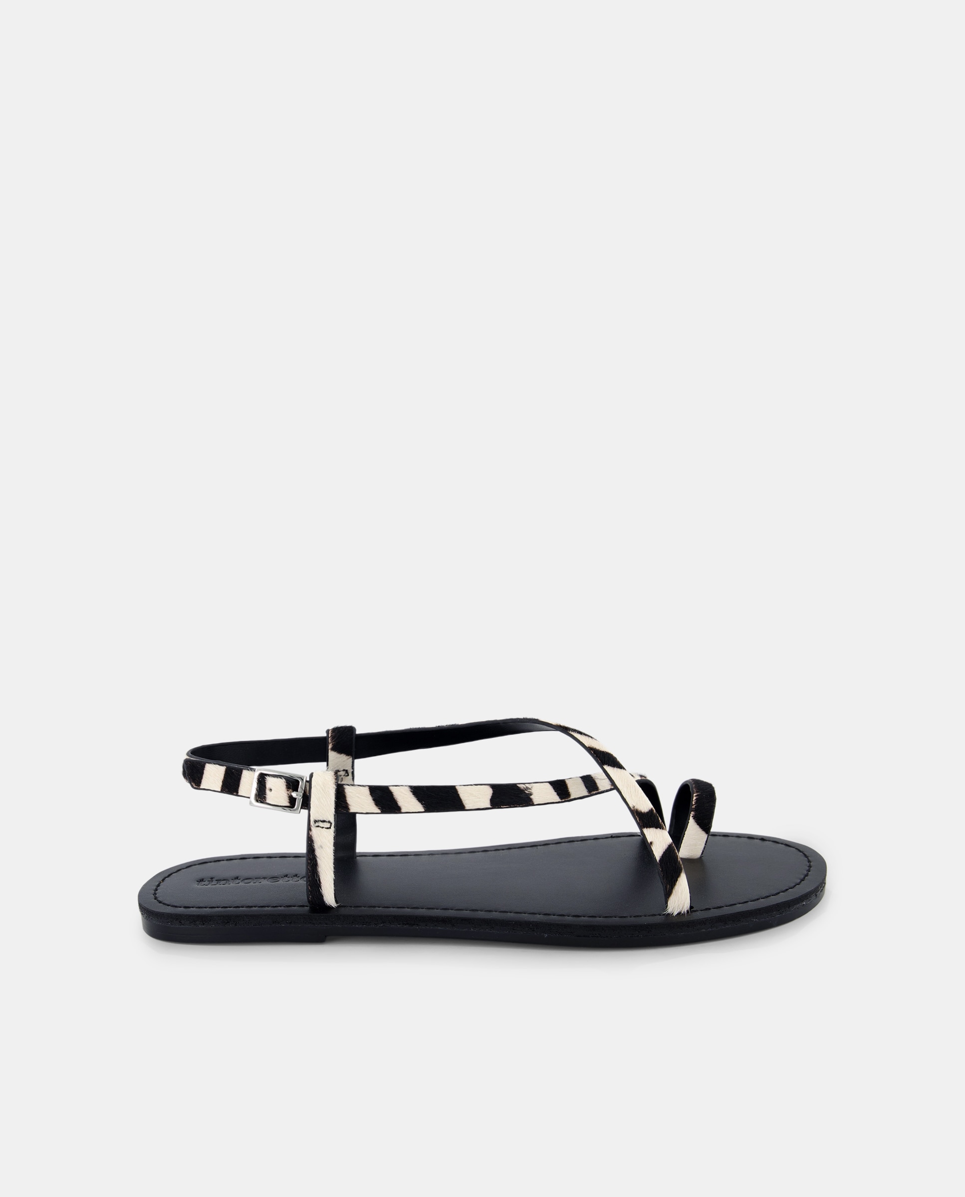 Imagen 0 de Sandalias planas de mujer con estampado cebra