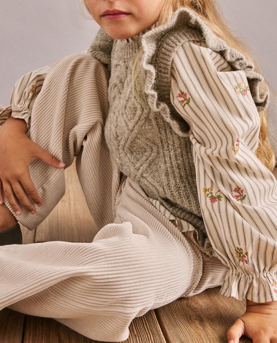 Chaleco fantasía con lazadas en tejido con lurex de niña — oferta en Primeriti
