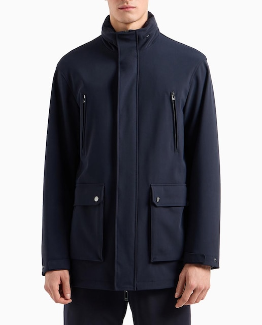 Imagen 0 de Trench de hombre en tejido técnico con capucha