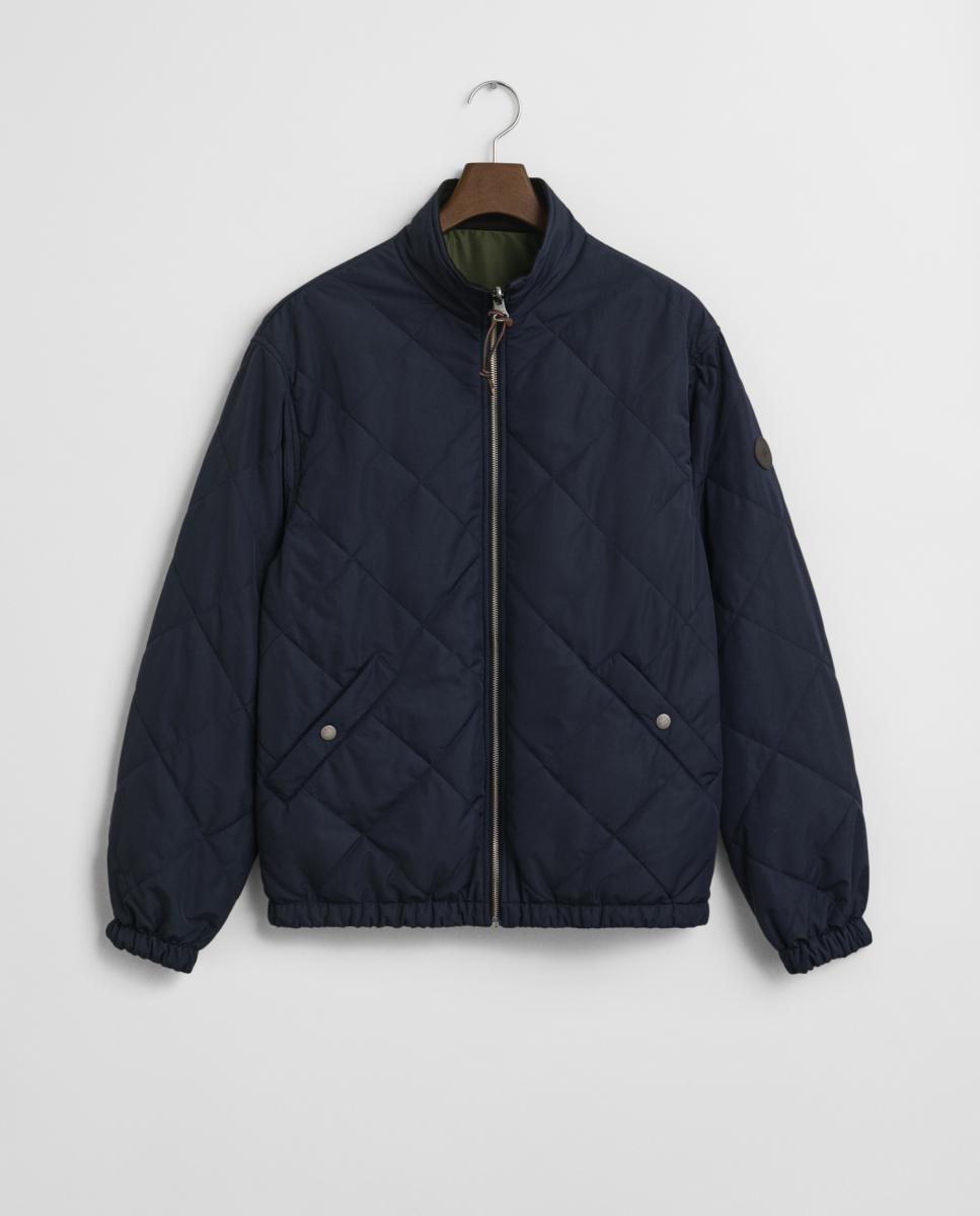 Imagen 0 de Chaqueta acolchada reversible de hombre, versátil y ligera, con cierre frontal, cuello de pana y bolsillos laterales.
