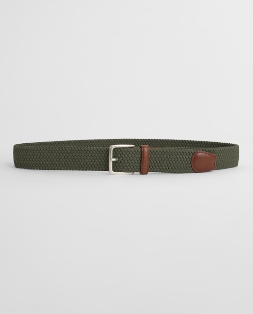 Imagen 0 de Cinturón trenzado de hombre en material flexible con detalles de piel, hebilla metálica.