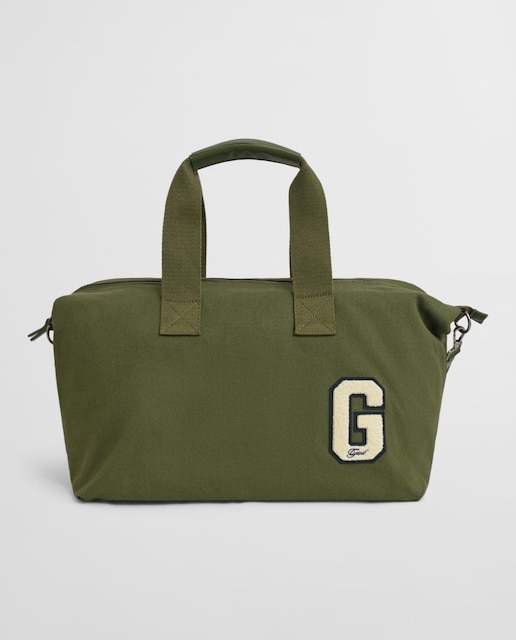 Imagen 0 de Bolsa de viaje de hombre en lona de algodón suave, con asas superiores, bolsillo interior con cremallera y correa ajustable desmontable.