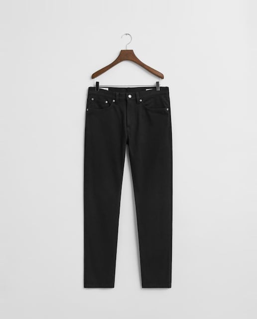 Imagen 0 de Vaqueros de hombre en sarga cepillada elástica con corte slim y diseño de cinco bolsillos.