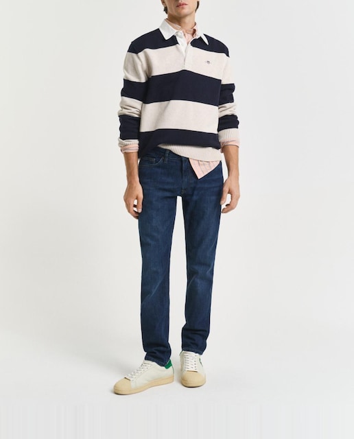 Imagen 0 de Vaqueros de hombre en mezcla de algodón elástico con corte slim y efecto desgastado.