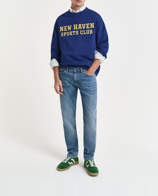 Imagen 0 de Vaqueros de hombre en mezcla de algodón elástico con corte slim y efecto desgastado.