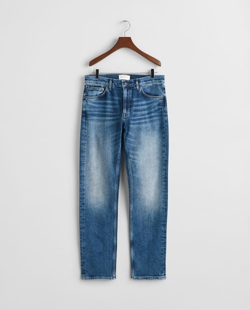 Imagen 0 de Vaqueros de hombre en mezcla de algodón elástico con corte slim y efecto desgastado.