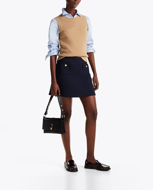 Imagen 0 de Mini falda de punto lisa con bolsillos frontales