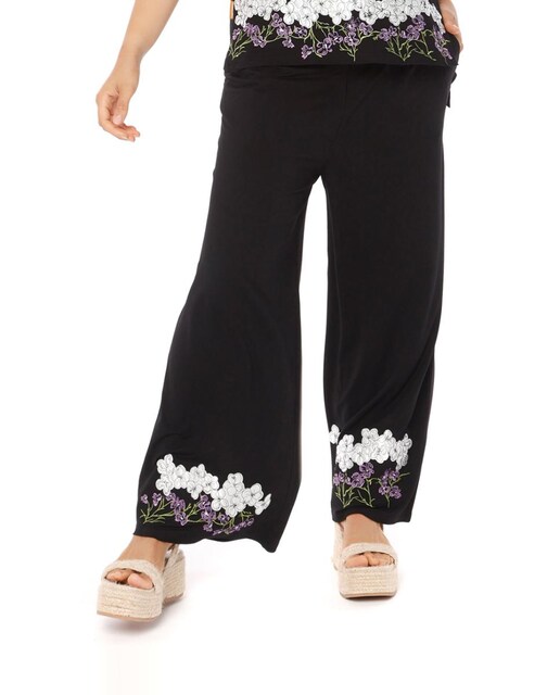 Imagen 0 de Pantalón ancho con botones y cremallera y bordado en ambas perneras
