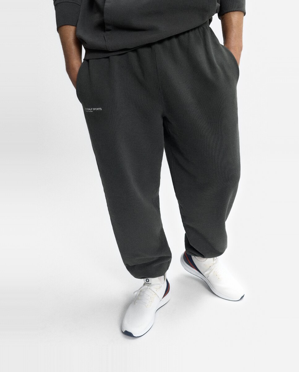 Imagen 0 de Pantalones cómodos con cintura ajustable por cordones y print lateral derecho.