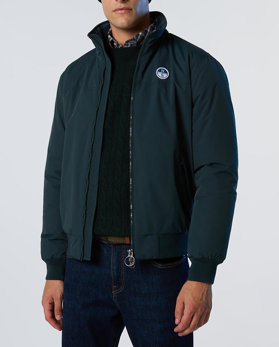 Imagen 0 de Chaqueta icónica en nylon reciclado, repelente al agua, con ribetes, bolsillos y cremallera doble.