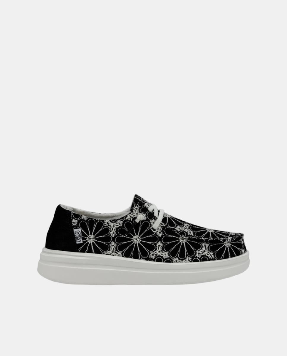 Imagen 0 de Mocasín para mujer de lona con bordado floral y plataforma ligera.