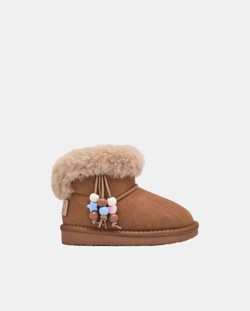 Imagem 0 de Botas Australianas com Pelo e Adorno Pendente em Couro