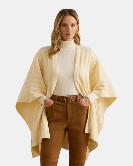 Imagen 0 de Poncho de punto de mujer con bolsillos y logo.