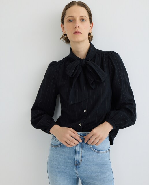 Imagen 0 de Blusa de mujer de lurex con lazada en cuello