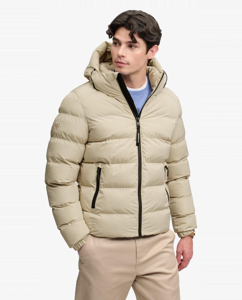 Imagen 0 de Chaqueta acolchada deportiva de hombre con capucha Crudo