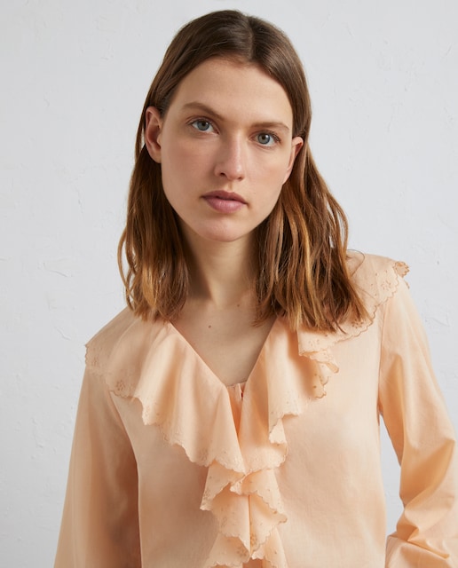 Blusa lisa con volante