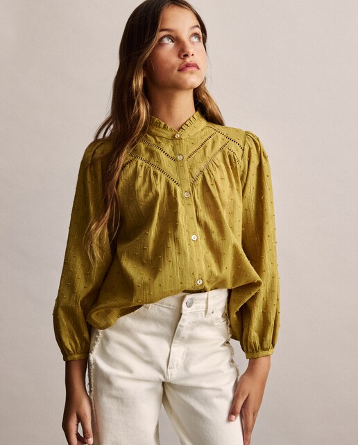 Imagem 0 de Blusa Lisa de Manga 3/4 com Cortes e Fio Metalizado