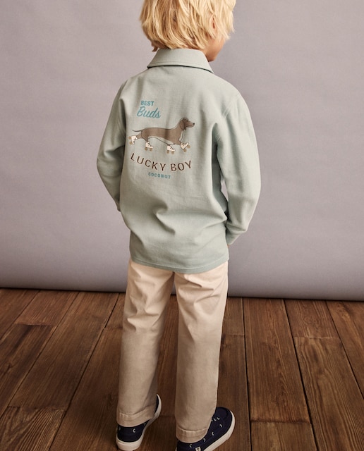 Imagen 0 de Polo de manga larga piqué print fantasía delante y detrás de niño