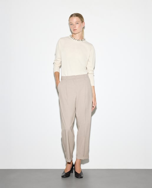 Imagen 0 de Pantalón de mujer con pliegue y vuelta en el bajo