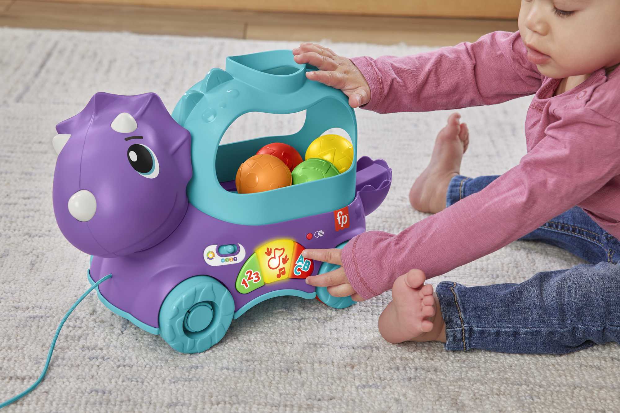 Dinosaurio de juguete de arrastre con bolas, luces y sonidos Fisher-Price 4
