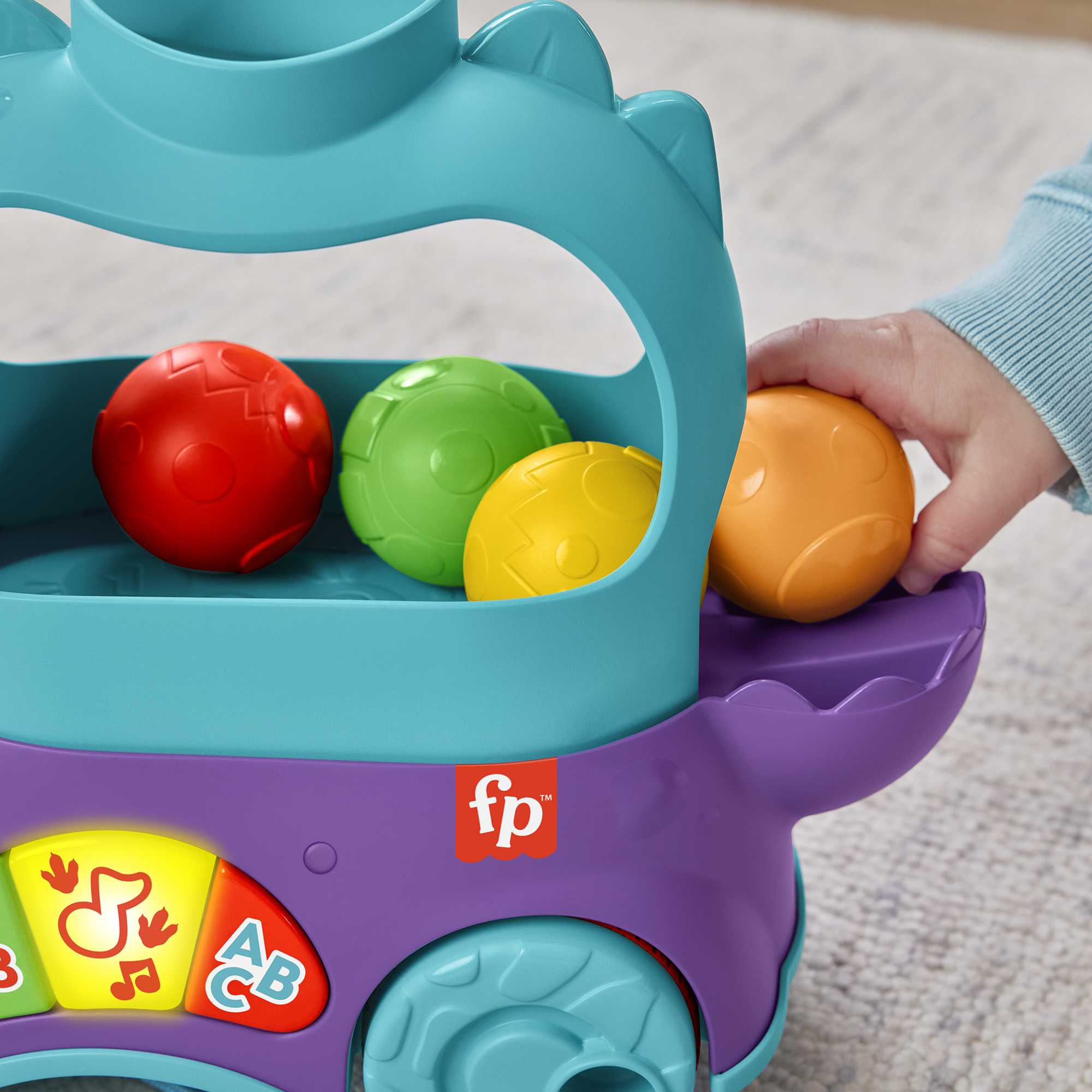Dinosaurio de juguete de arrastre con bolas, luces y sonidos Fisher-Price 8