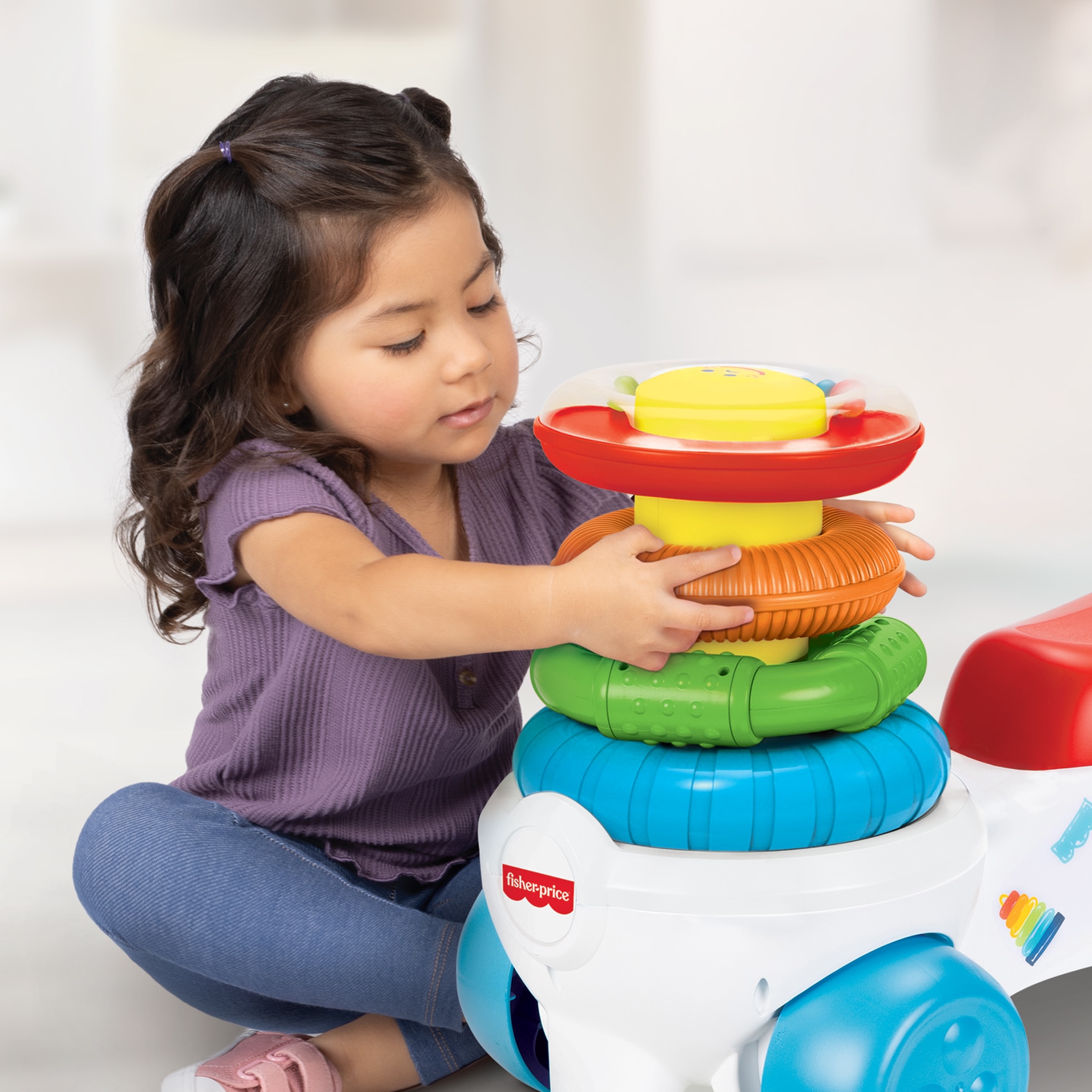 Correpasillos Rock 'n' Stack con divertida torre anillos sensoriales Fisher-Price Jakks Pacific 3