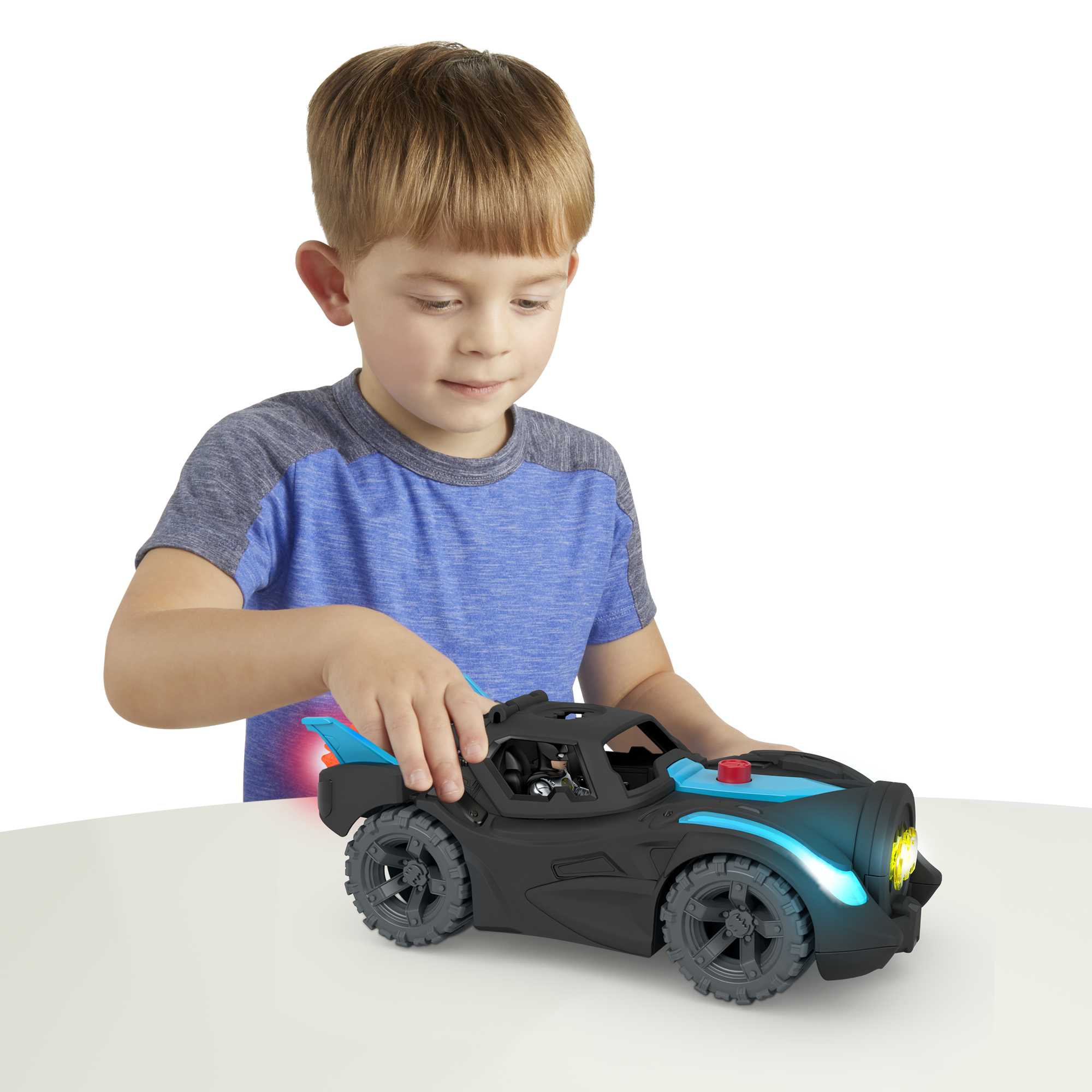 DC Super Friends Batmóvil Power Reveal Coche de juguete con luces ultravioleta y sonidos, incluye figura de Batman 2