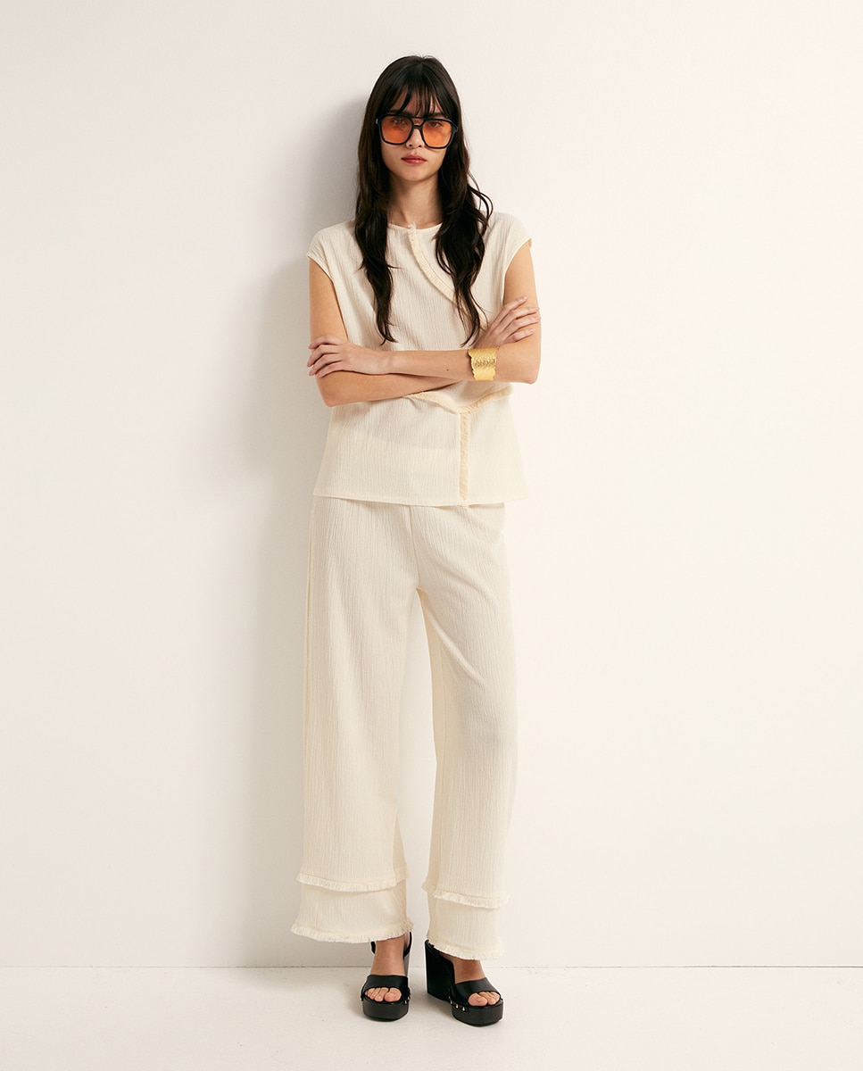 Imagem 0 de Calças com Textura e Franjas