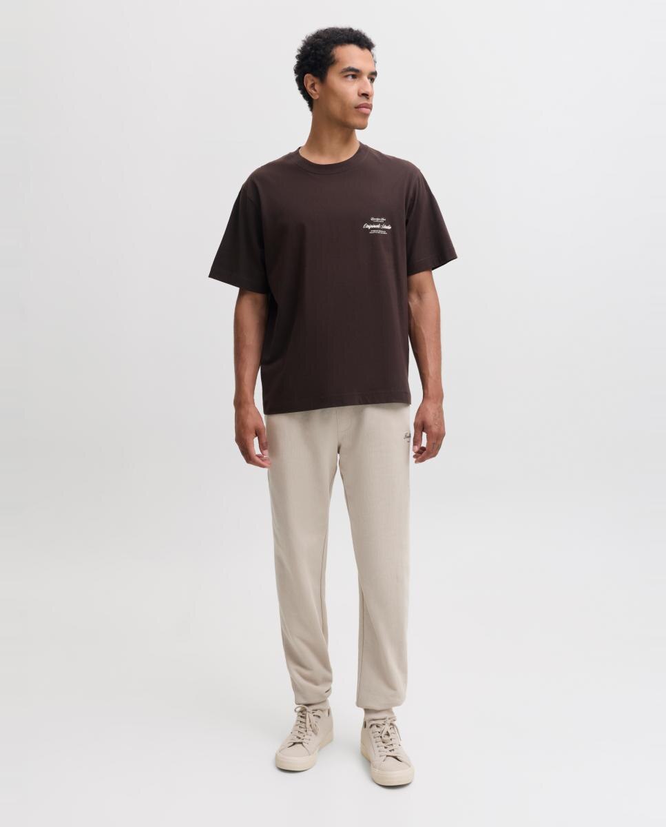 Imagen 0 de Pantalón jogger de hombre regular fit con cintura ajustable Crema
