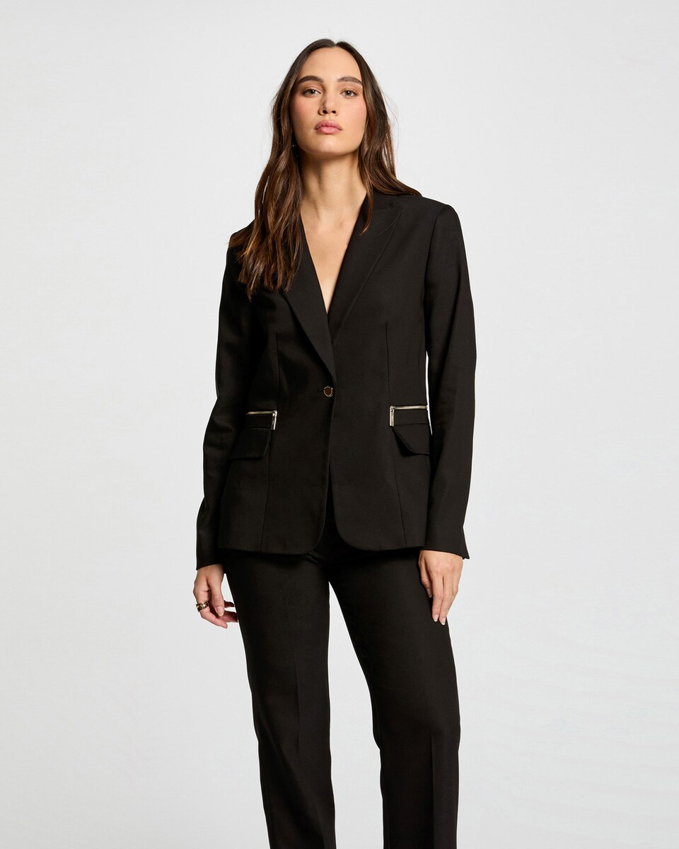 Chaqueta de mujer con cierre de botón y detalles cremallera