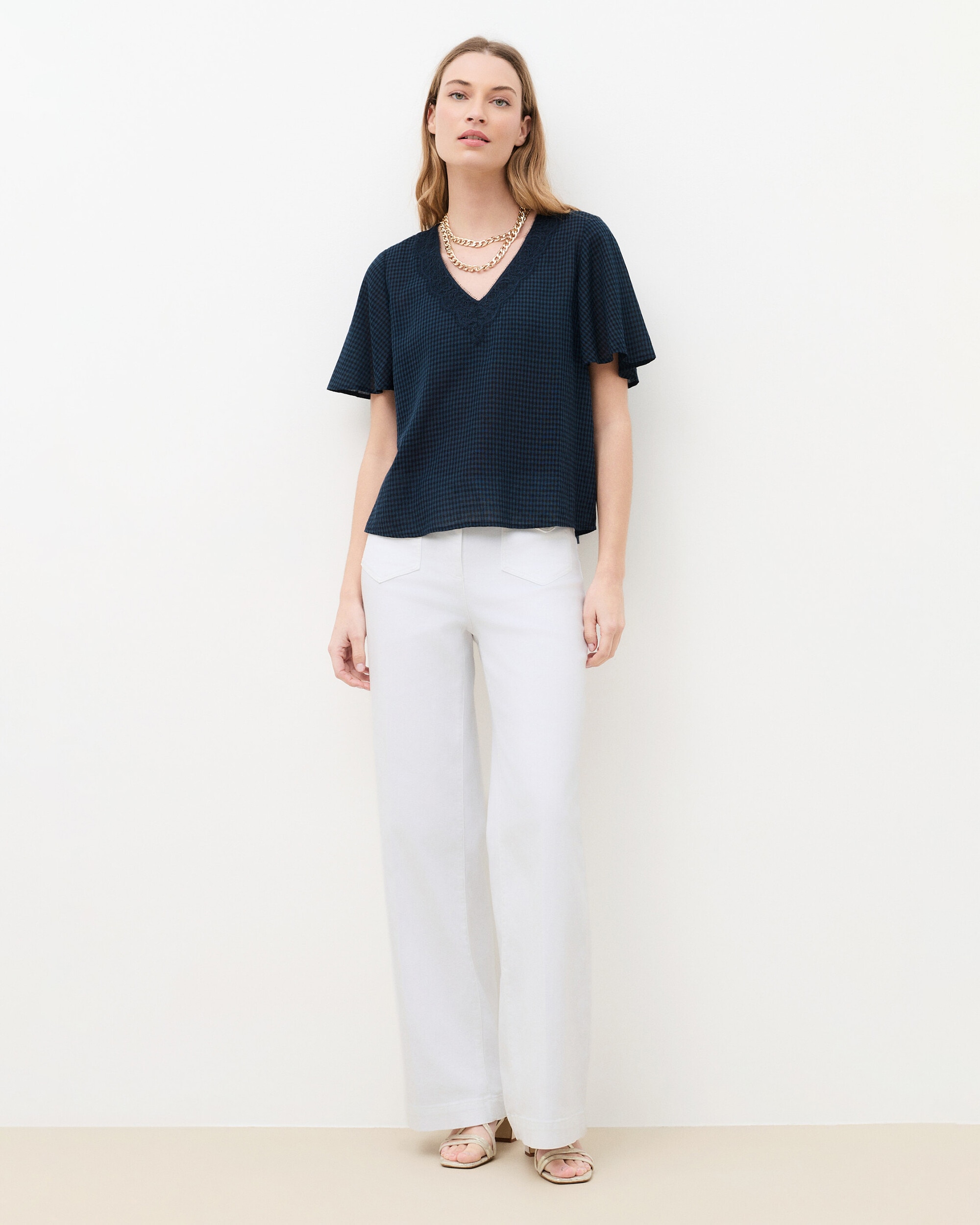 Caroll - Camiseta de mujer con cuello pico y estampado de cuadros.