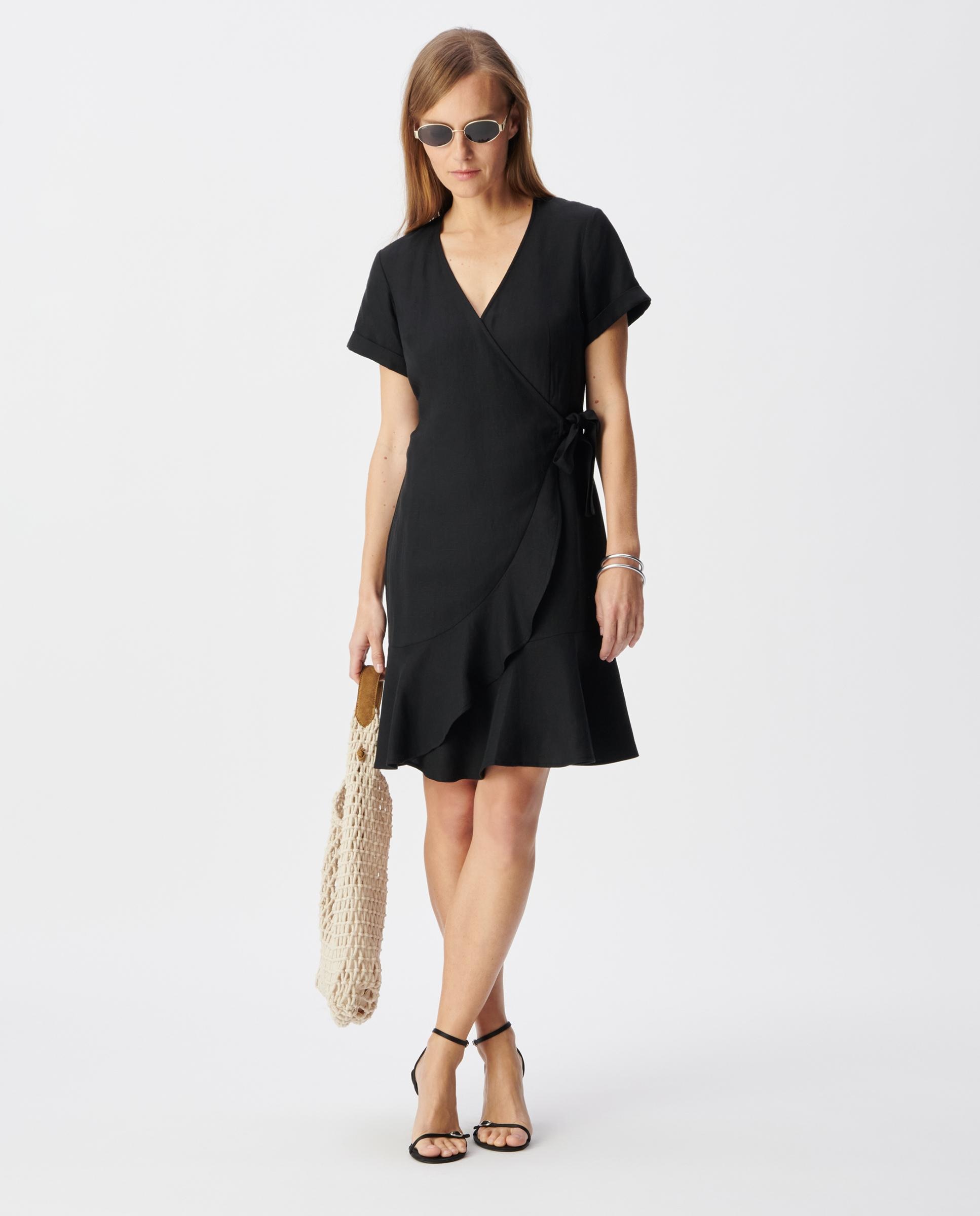 IKKS - Vestido corto cruzado con volantes.