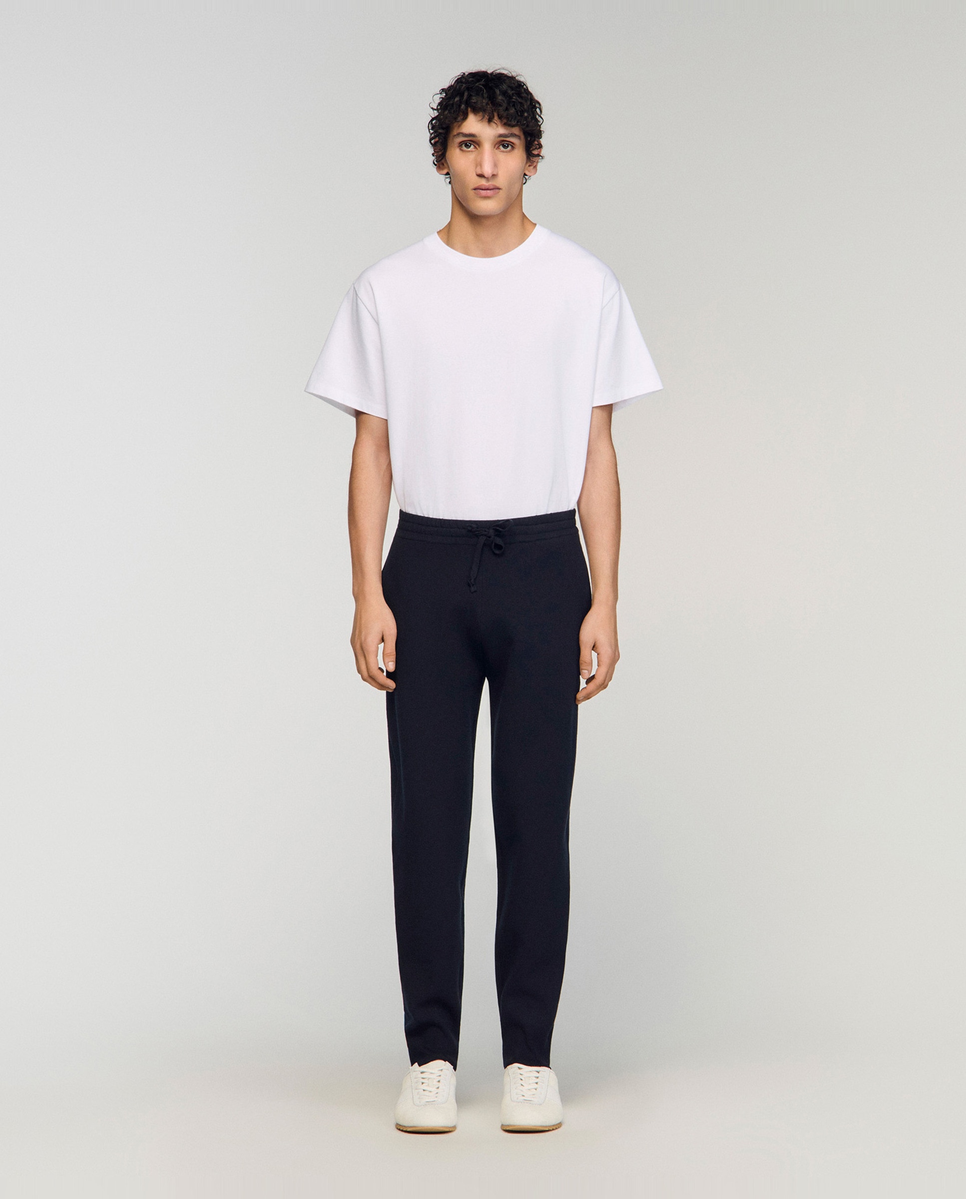 Sandro - Pantalón jogger de hombre en punto doble con puños acanalados.