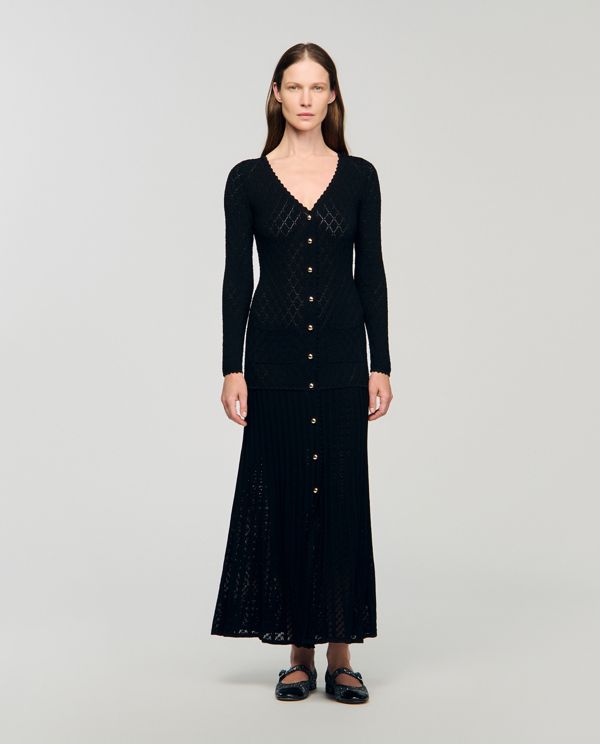 Imagen 0 de Vestido largo de punto de fantasía con cuello en v y bajo acampanado Negro