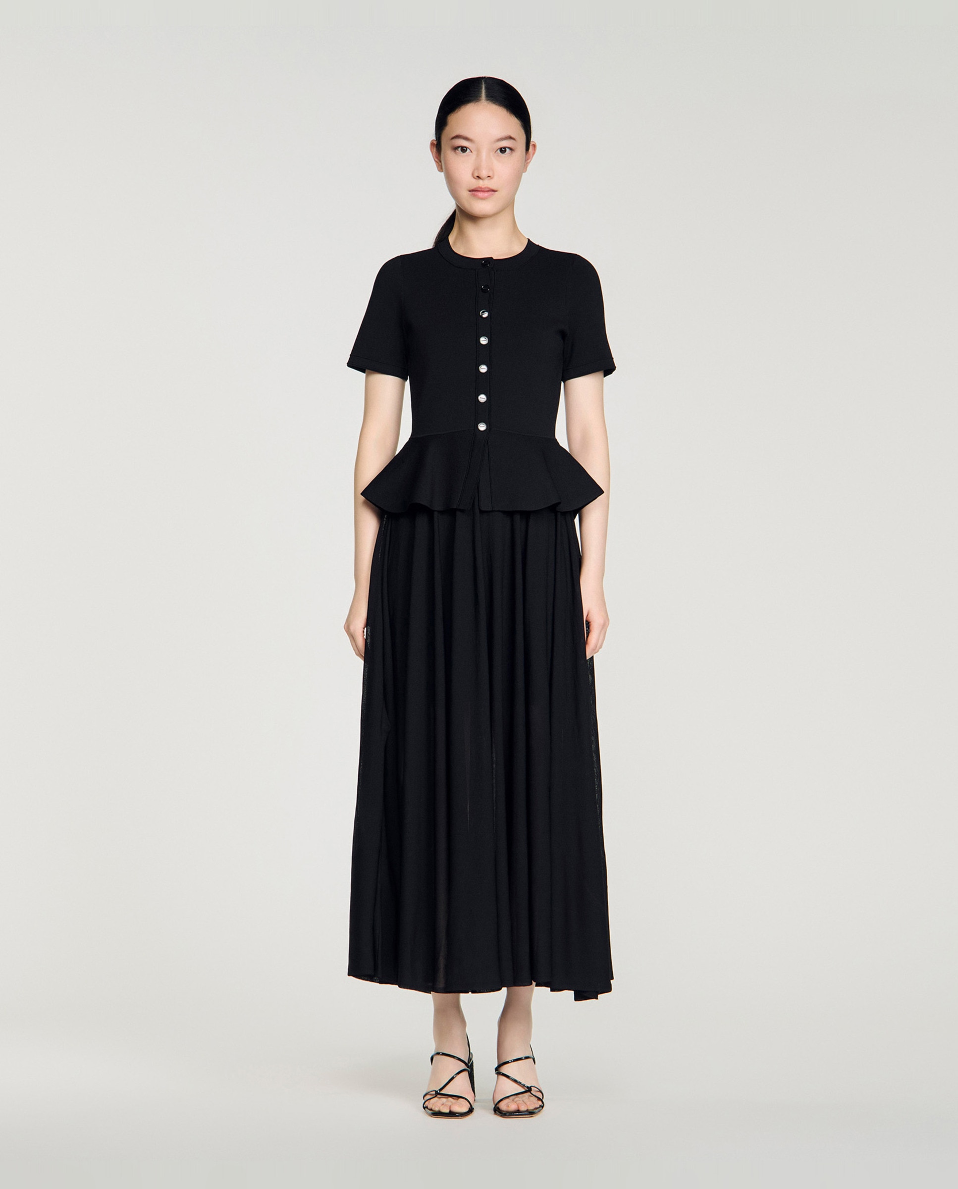Sandro - Vestido de punto largo con peplum.